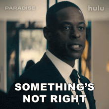 a man in a suit and tie says something 's not right on a hulu ad