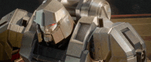 a close up of a robot with red eyes looking at the camera