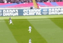 a soccer game is being played on a field with a banner that says " dana sempre dano "