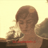 a woman is reading a book and the words go asphodel < 3 are visible