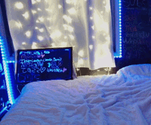 a bed with a sign on it that says ' i love laugh '