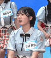 a girl with a name tag that says " a " on it