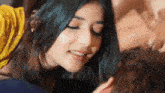 a close up of a woman kissing a man 's neck .