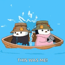 two penguins are in a boat with the words this was me written on the bottom .