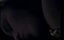 a close up of a person 's feet in a dark room