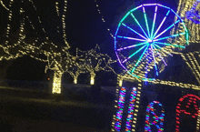 a blurry picture of christmas lights with the word christmas visible in the middle