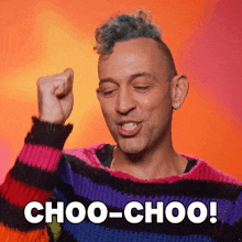 a man wearing a colorful sweater with the words choo-choo written on it