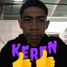a man giving a thumbs up with the word keren