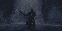 a man holding a scythe in a cave