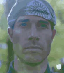 a close up of a man 's face behind a fence .