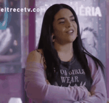 a woman is wearing a black shirt that says " good girls wear "