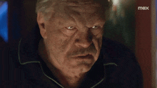 a close up of a man 's face with the word max on the bottom right