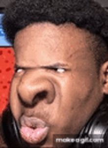 a close up of a man 's face with a big nose .