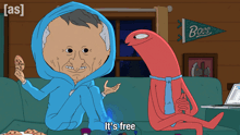a man in a blue hoodie sits on a couch next to a red monster that says " it 's free "