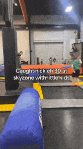 a boy is jumping on a trampoline with a caption that says " caught nick eh 30 at skyzone with little kids "