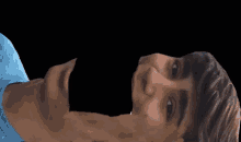 a man laying down with his mouth open and a woman standing in the background