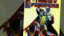 a comic book called the transformers is displayed on a table
