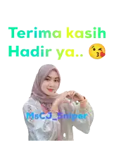 a woman in a hijab making a heart with her hands