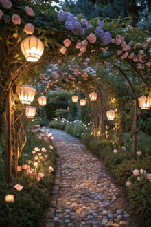 a path in a garden with lanterns and flowers on it