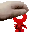 a hand is holding a red stuffed animal with a sword .