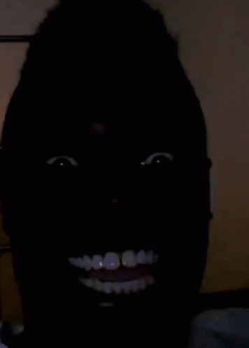 creepy smile black guy