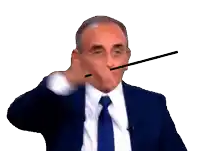 a man in a suit and tie is holding a baton in his right hand