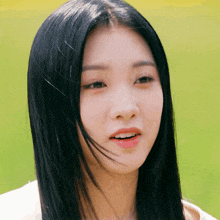 a close up of a woman 's face with her mouth open
