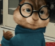 alvin the chipmunk wearing glasses and a blue sweater is giving a thumbs up .