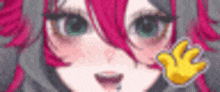 a close up of a girl with pink hair and green eyes .
