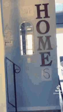 a sign on a wall that reads homes