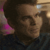 a close up of a man 's face with his eyes closed and his mouth open