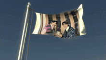 a flag with a picture of two boys on it