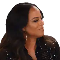 a woman with long dark hair is wearing a black sequined top and earrings