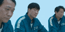 a man in a blue uniform with the number 218 on his chest