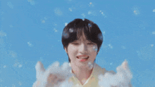 a close up of a person 's face with a blue sky behind them