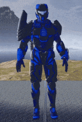 a blue and black armored figure stands on a brick surface