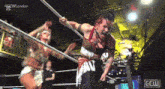 two women are wrestling in a ring with a sign that says gcw london on it