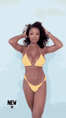 a woman in a yellow bikini is standing in front of a blue background that says new