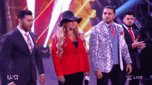 a group of people standing in front of a screen that says usa live on it
