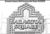 a black and white photo of a sarasota square mall