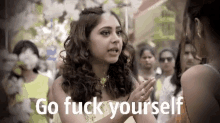 a woman talking to another woman with the words go fuck yourself above her