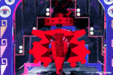 a person in a red costume stands in front of a purple archway