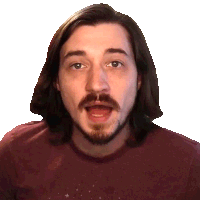a man with long hair and a beard wearing a maroon shirt