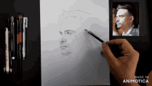 a person is drawing a man 's face with a pencil on a piece of paper that says made in animonica