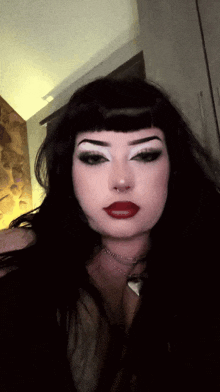 a woman with a nose ring and red lips