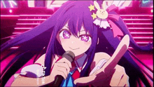 a girl with long purple hair is holding a microphone in her hand .