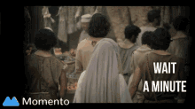 a screen shot of a crowd of people with the words wait a minute