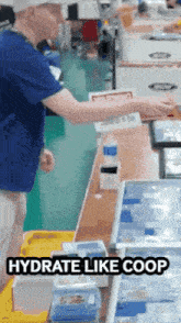 a man standing at a counter with the words hydrate like coop written below him