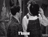two men are standing next to each other and one of them says y know