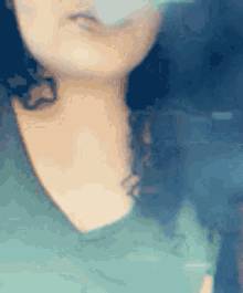 a close up of a woman 's face with a blurred background .